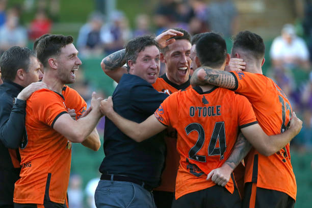 robbie-fowler-coach-of-the-roar-celebrates-with-his-players-after-a-picture-id1180750108